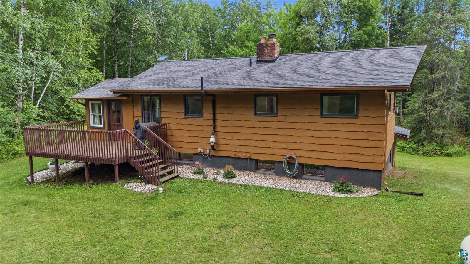 6377 Bergstrom Road Saginaw, MN 55779 - Photo 2 of 20 Single-story residence featuring a wood deck with railings and steps