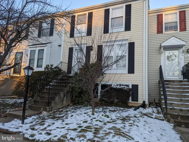 a brick building with a sink and a yard
