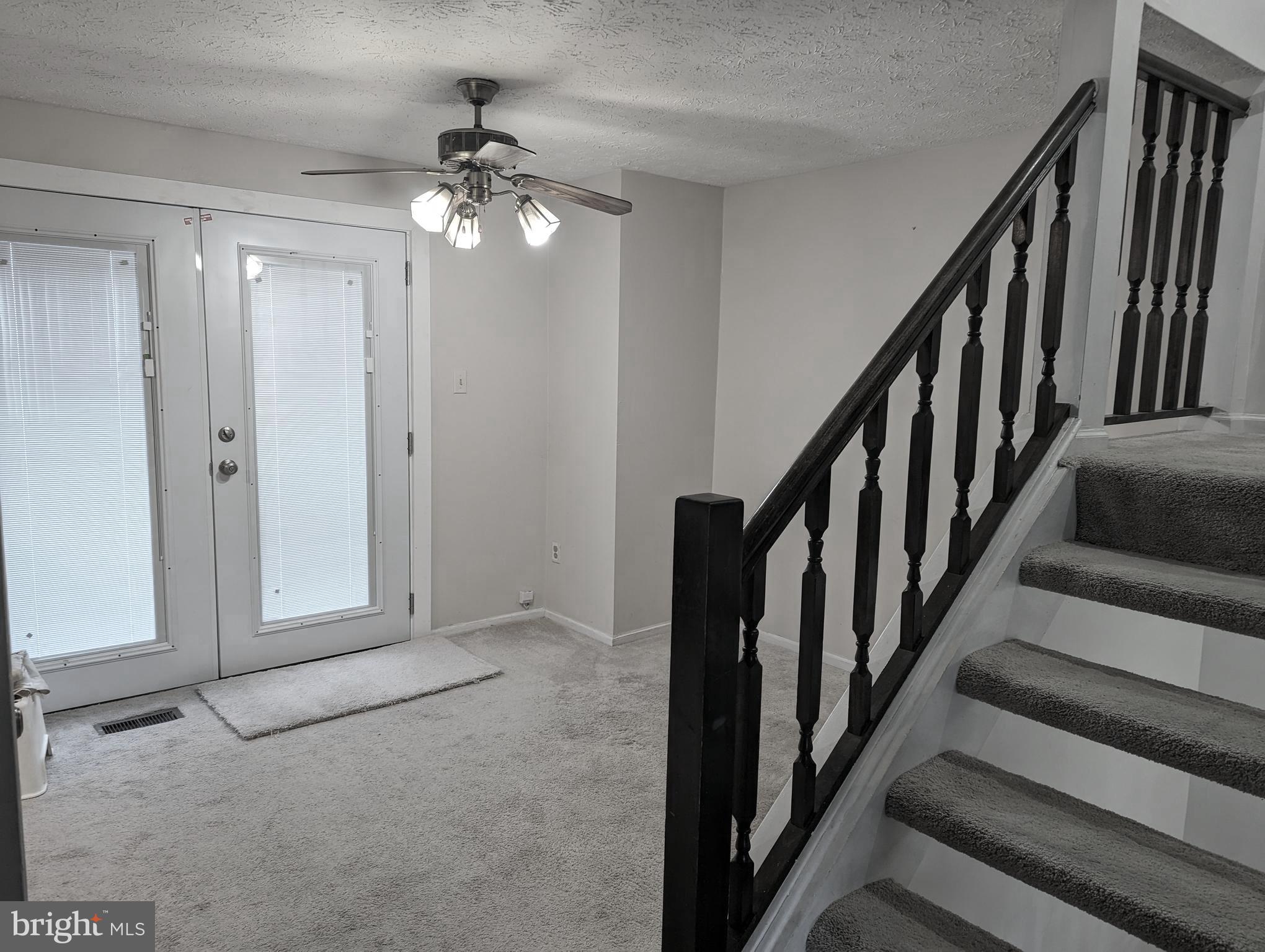 9119 Aspenpark Court Lorton, VA 22079 - Photo 11 of 32 a view of an entryway with staircase