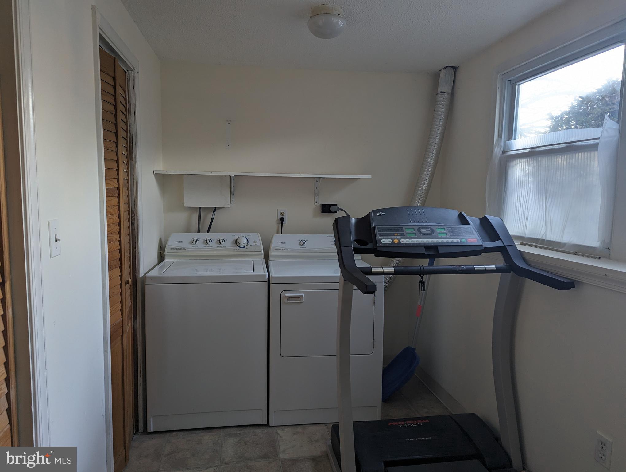 9119 Aspenpark Court Lorton, VA 22079 - Photo 21 of 32 a utility room with dryer and washer