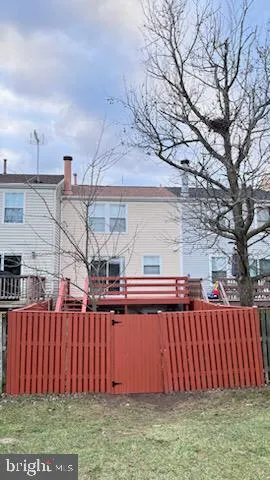 a view of a car parked in front of a brick house