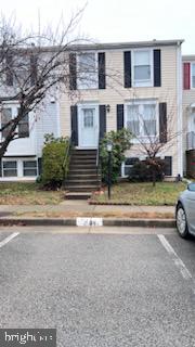 9119 Aspenpark Court Lorton, VA 22079 - Photo 31 of 32 a view of a car parked in front of a brick house