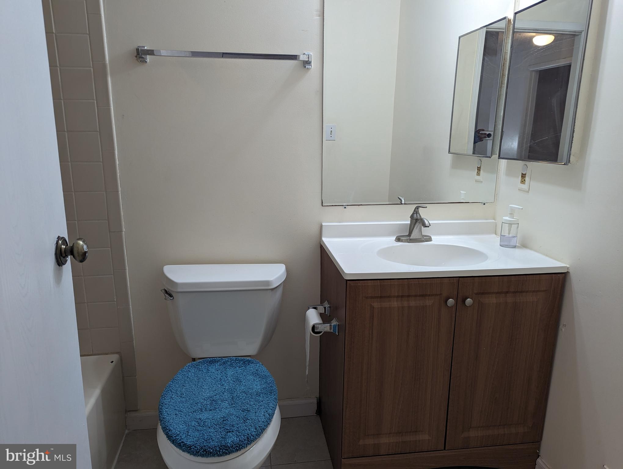 9119 Aspenpark Court Lorton, VA 22079 - Photo 7 of 32 a bathroom with a sink vanity mirror and toilet