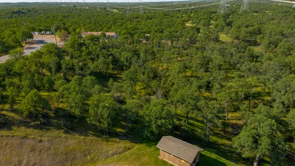 a view of a yard with an outdoor seating
