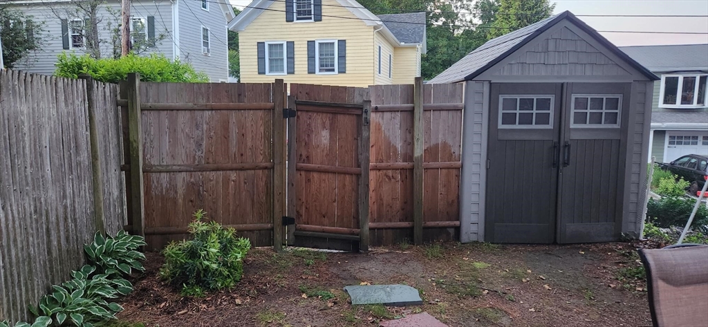 57 Green Street Marblehead, MA 01945 - Photo 14 of 29 a view of a small house with wooden fence