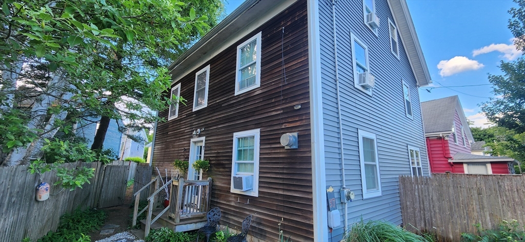 57 Green Street Marblehead, MA 01945 - Photo 17 of 29 a view of a house with a yard and plants