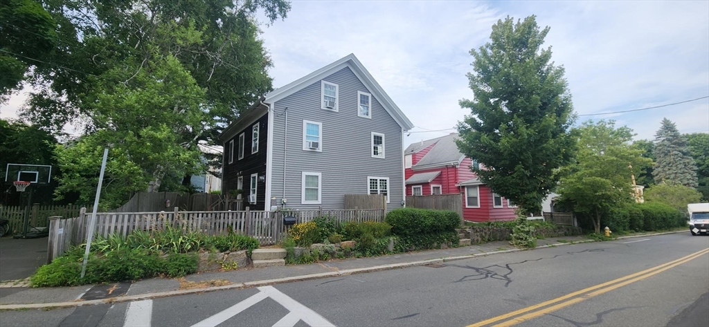 57 Green Street Marblehead, MA 01945 - Photo 25 of 29 a front view of a house with a yard and plants