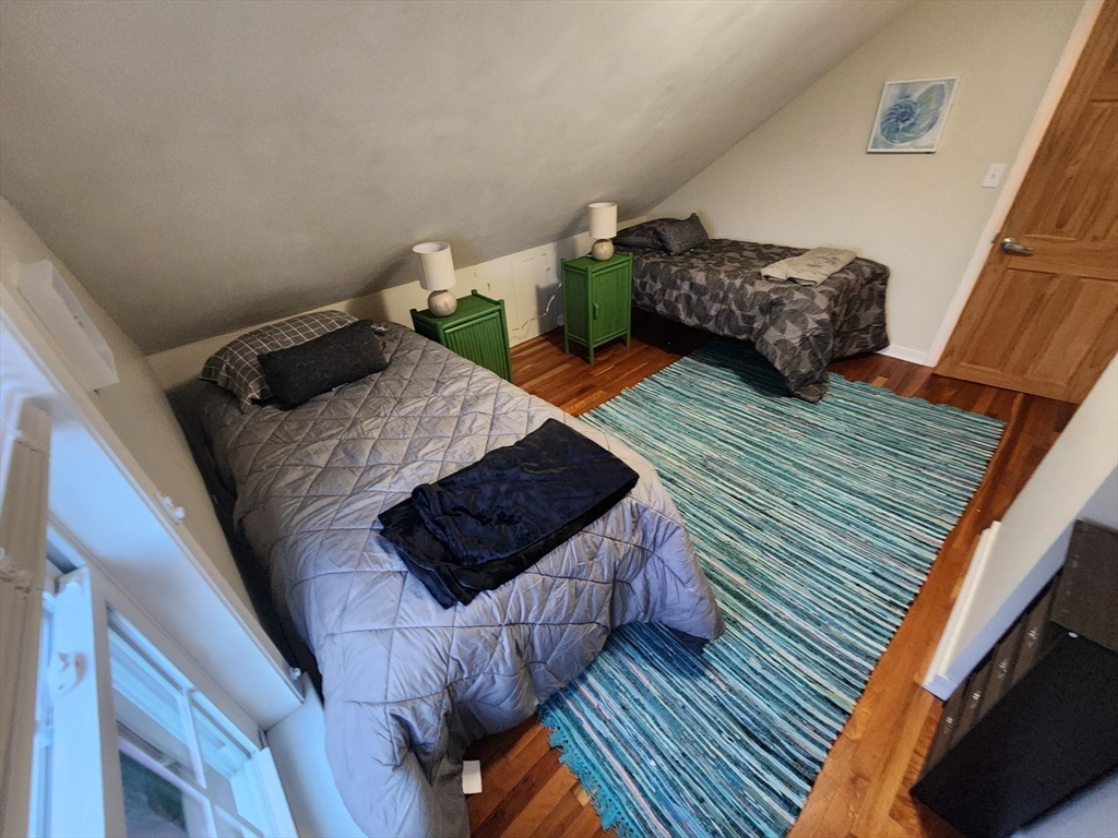 57 Green Street Marblehead, MA 01945 - Photo 10 of 29 a bed sitting in a bedroom next to a couch