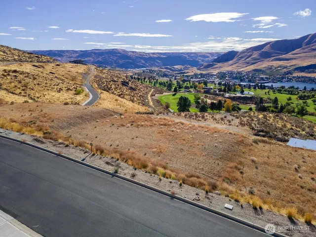 a view of an ocean beach and a mountain