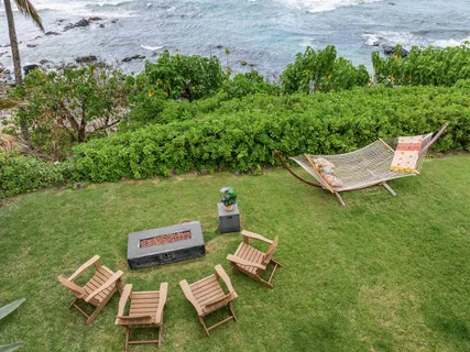 a view of a two chairs in a garden