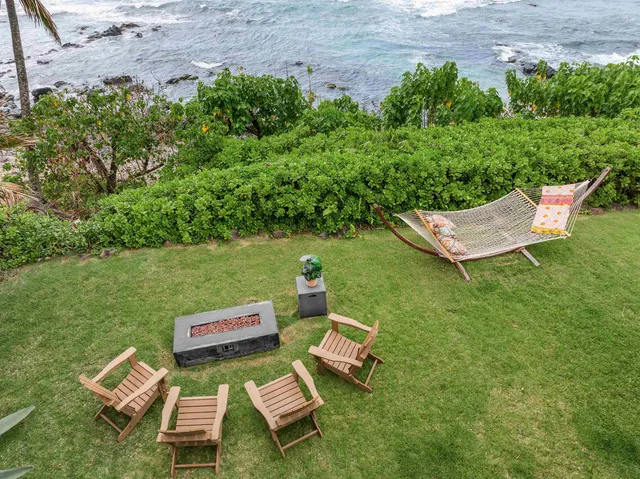 a view of a two chairs in a garden