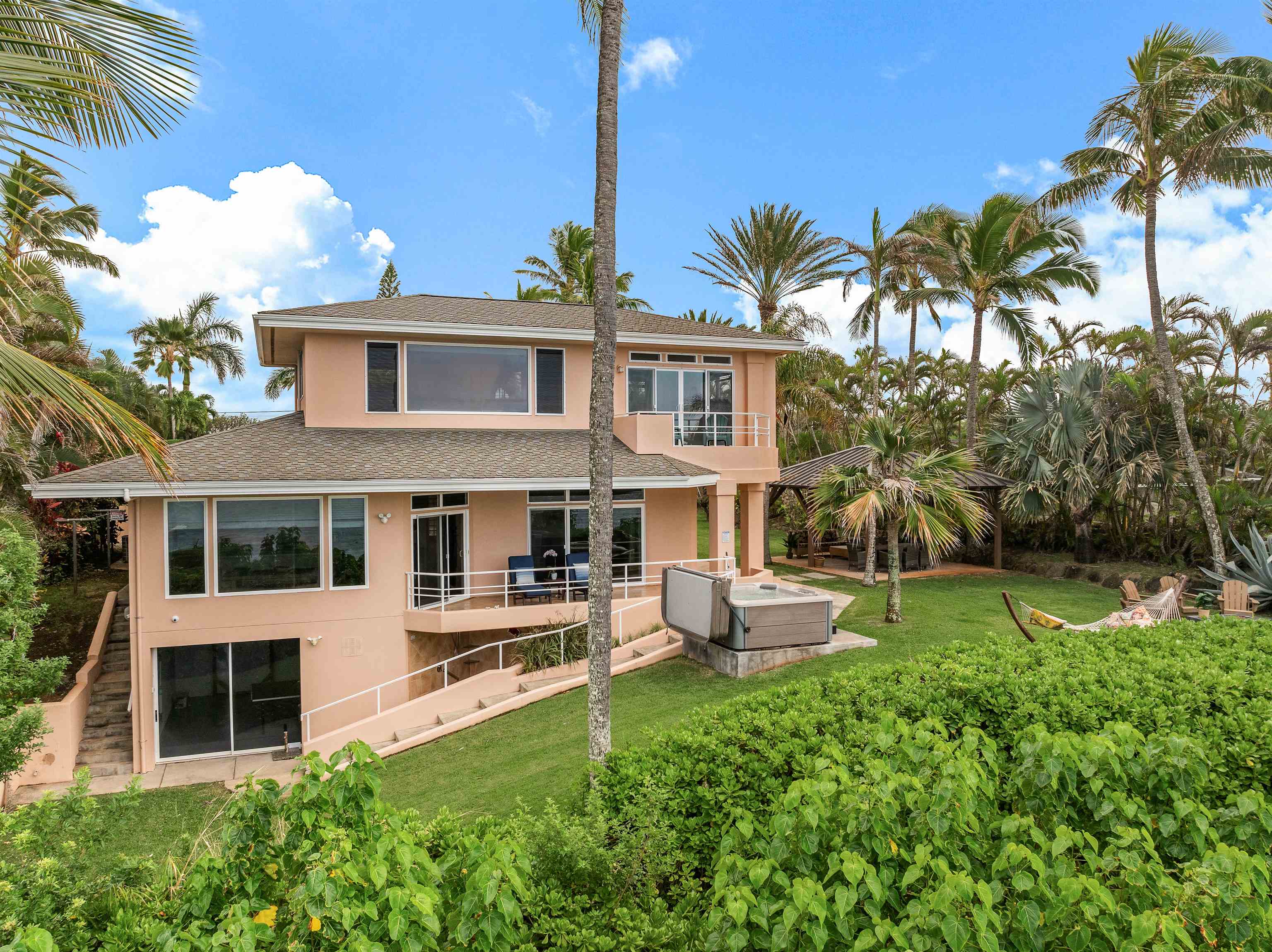 111 Aleiki Place Paia, HI 96779 - Photo 25 of 50 a front view of a house with garden and porch