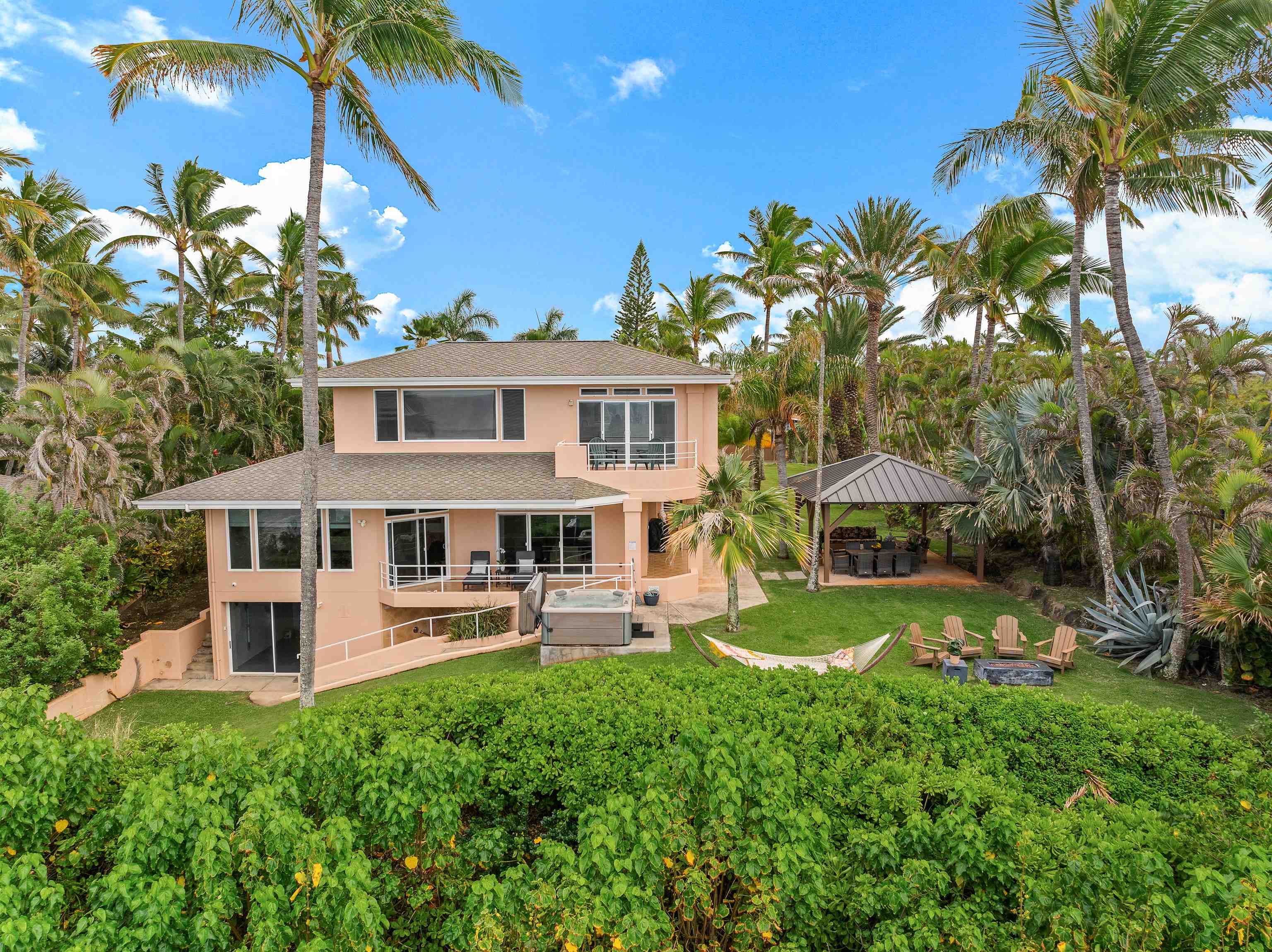 111 Aleiki Place Paia, HI 96779 - Photo 26 of 50 a front view of a house with garden