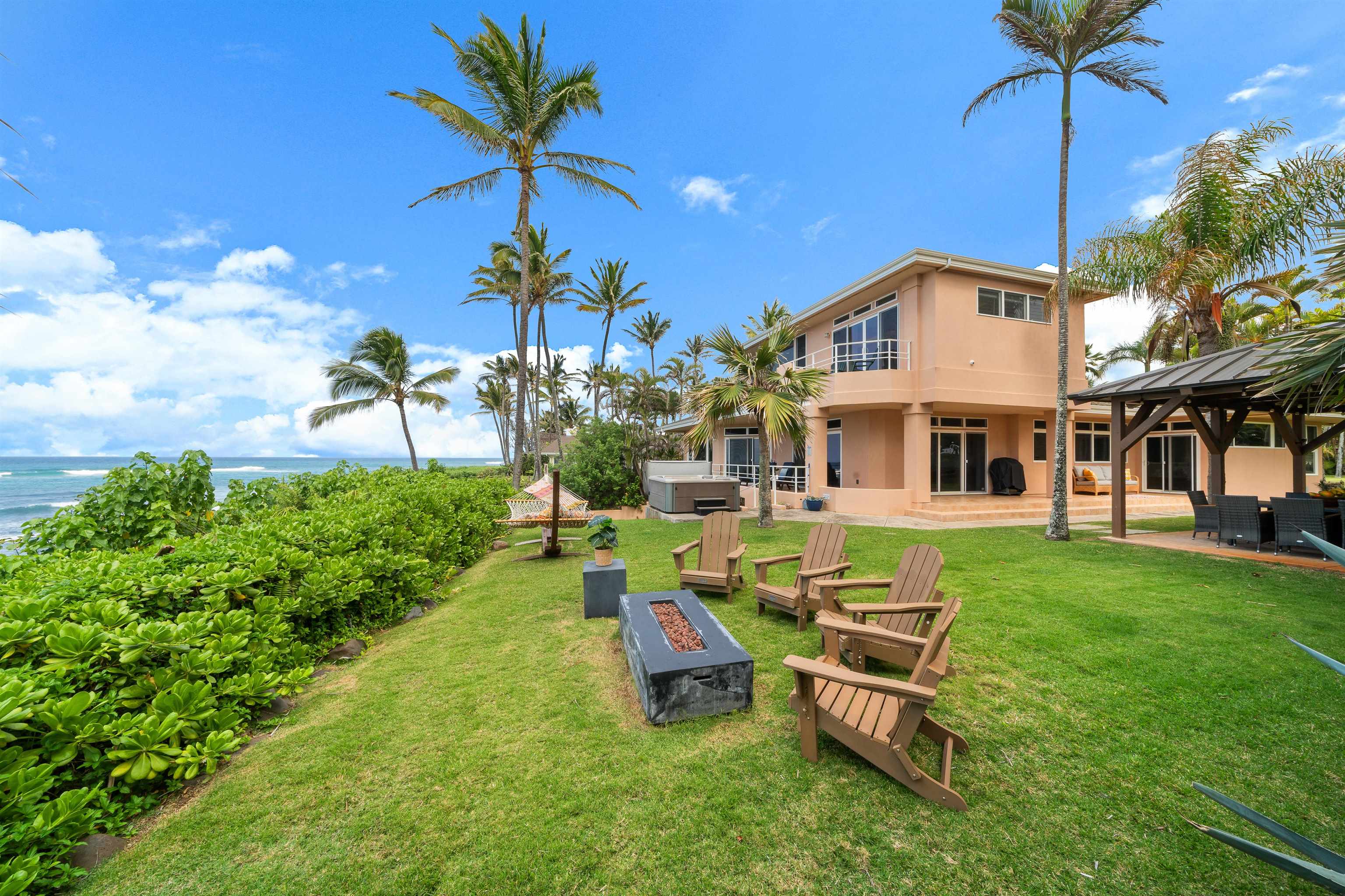 111 Aleiki Place Paia, HI 96779 - Photo 40 of 50 a backyard of a house with table and chairs
