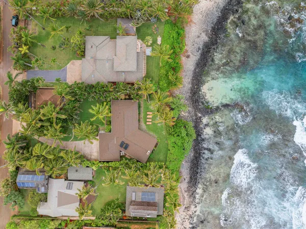 an aerial view of a house with outdoor space