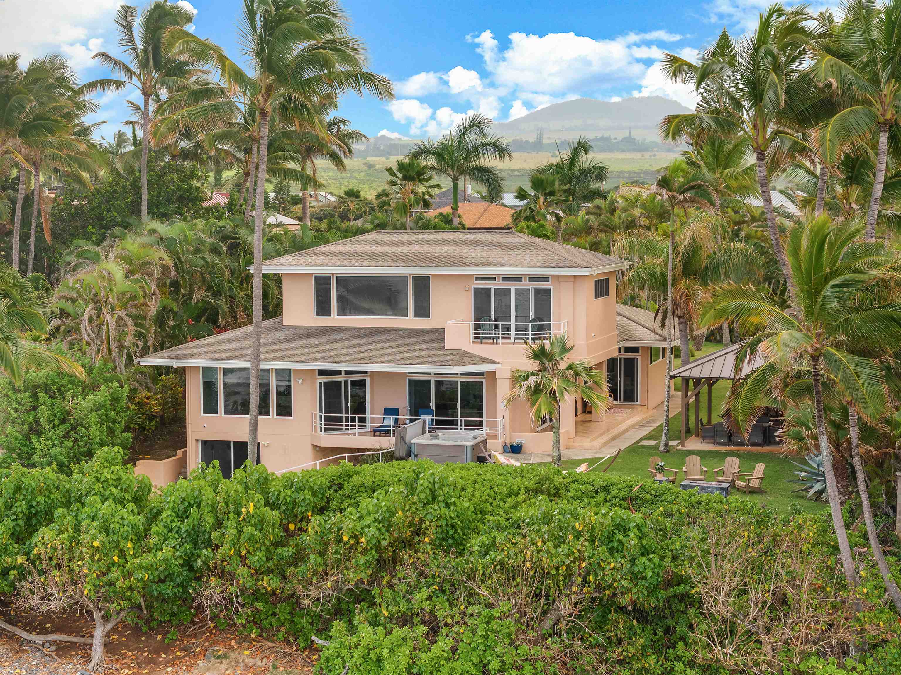 111 Aleiki Place Paia, HI 96779 - Photo 9 of 50 a front view of a house with garden