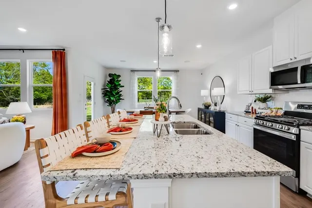 a kitchen with a table and chairs in it