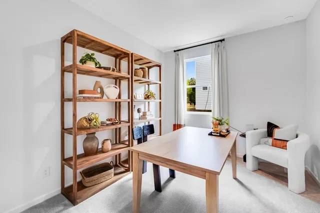 a spacious bathroom with a granite countertop sink a mirror and a shower