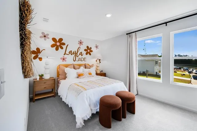 a picture of a bedroom with a bed