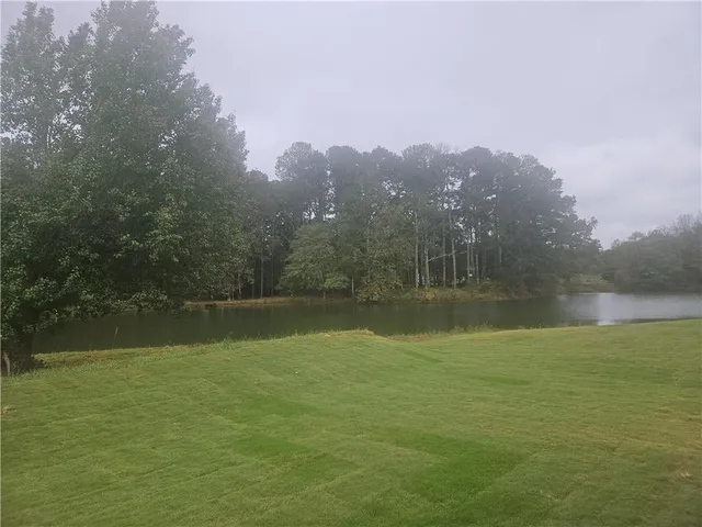 a view of lake with mountain in the back