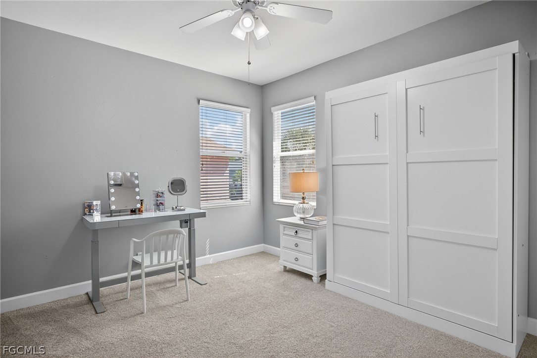 22866 Forest Ridge Drive Estero, FL 33928 - Photo 23 of 38 a view of a workspace with furniture and a window