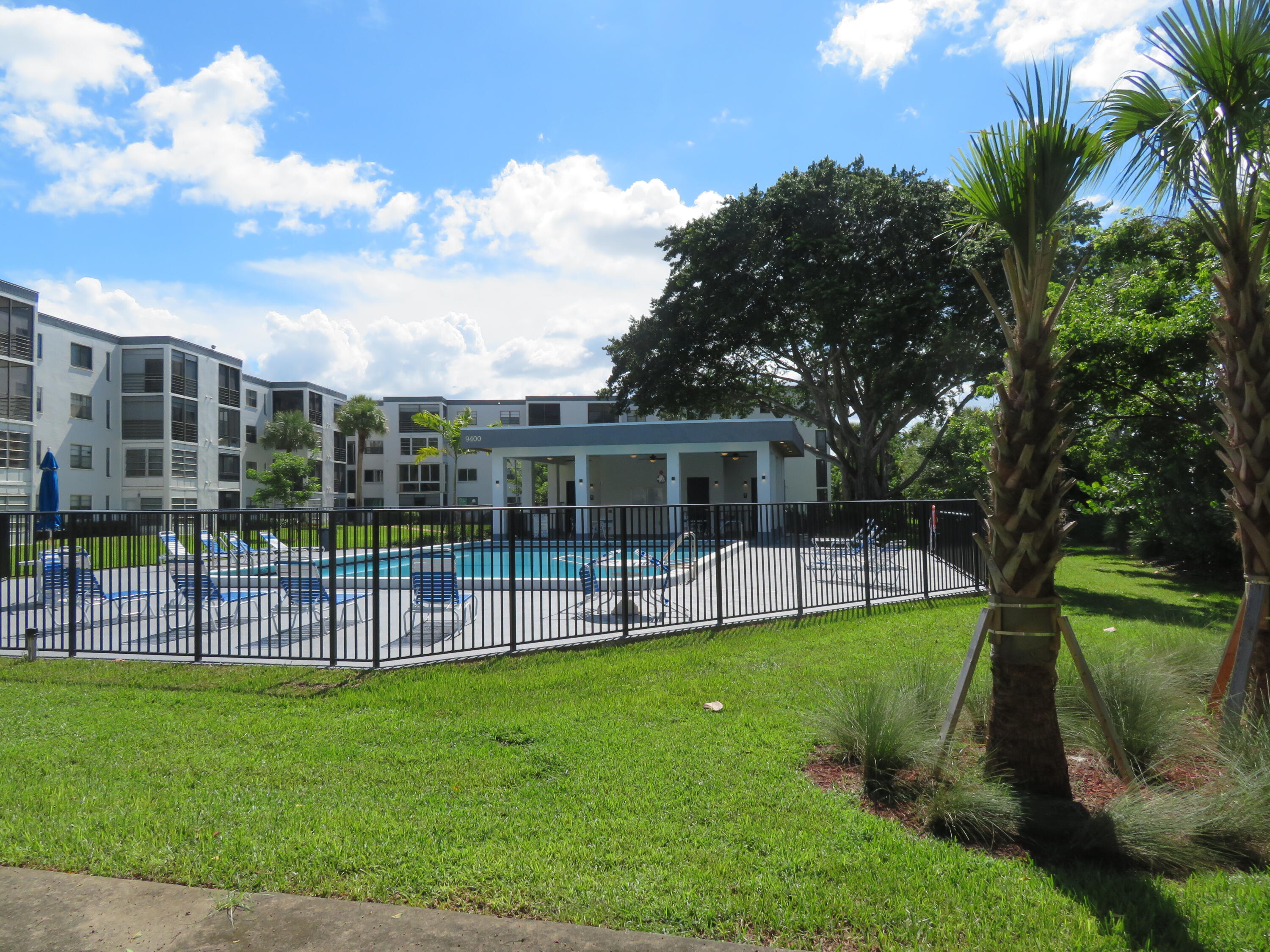 9233 Southwest 8th Street, Unit 117 Boca Raton, FL 33428 - Photo 16 of 37 35_9233_Bldg_PoolJPG