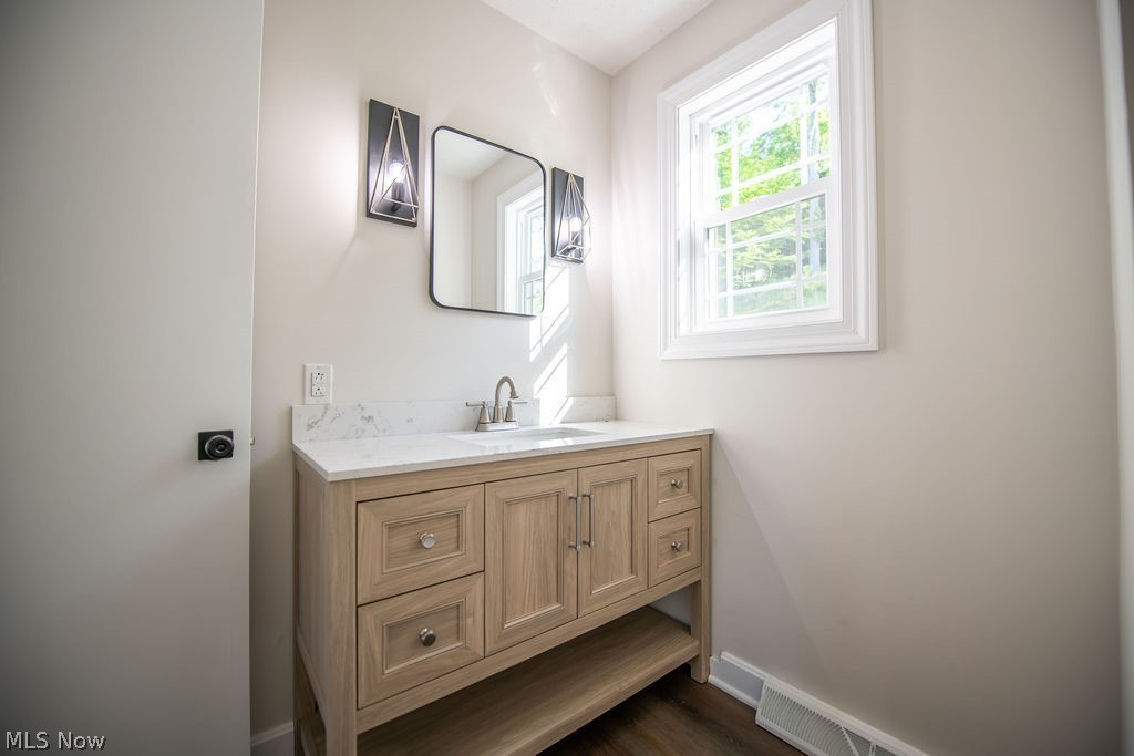 5234 Ribbon Road Southwest Bowerston, OH 44695 - Photo 29 of 50 Half bathroom featuring an abundance of natural light.