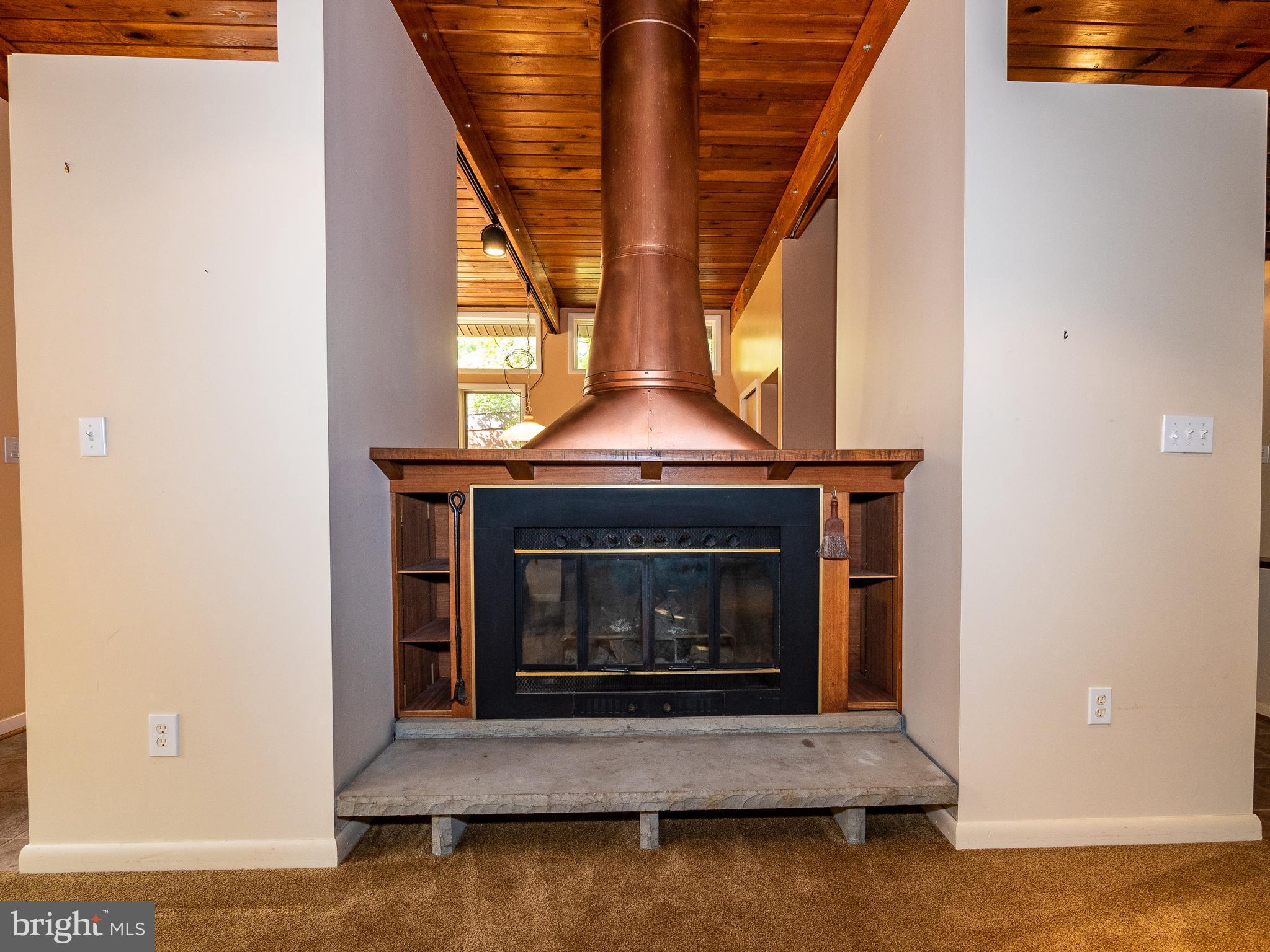 10124 Spring Pools Lane Columbia, MD 21044 - Photo 13 of 30 Beautiful wood burning fireplace with copper flue