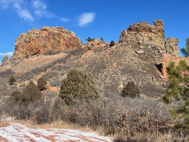 a view of mountain with beach and background