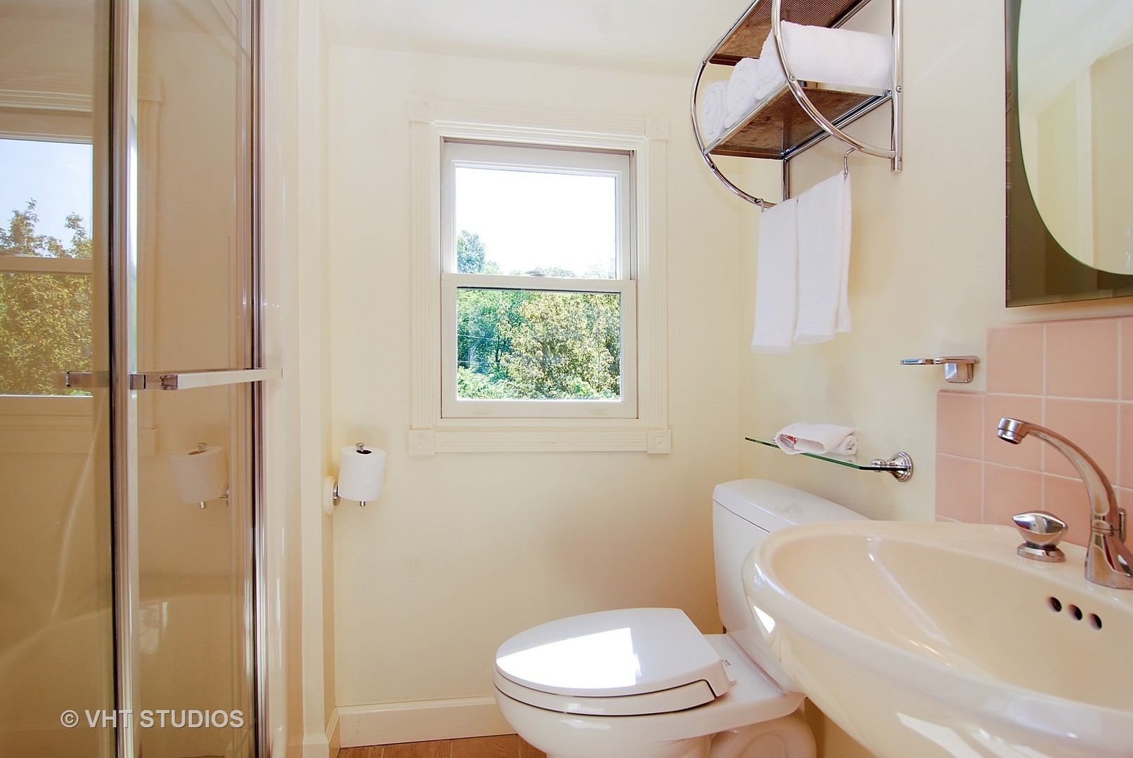 145 Woodside Road Riverside, IL 60546 - Photo 11 of 26 a white toilet sitting next to a bathroom sink