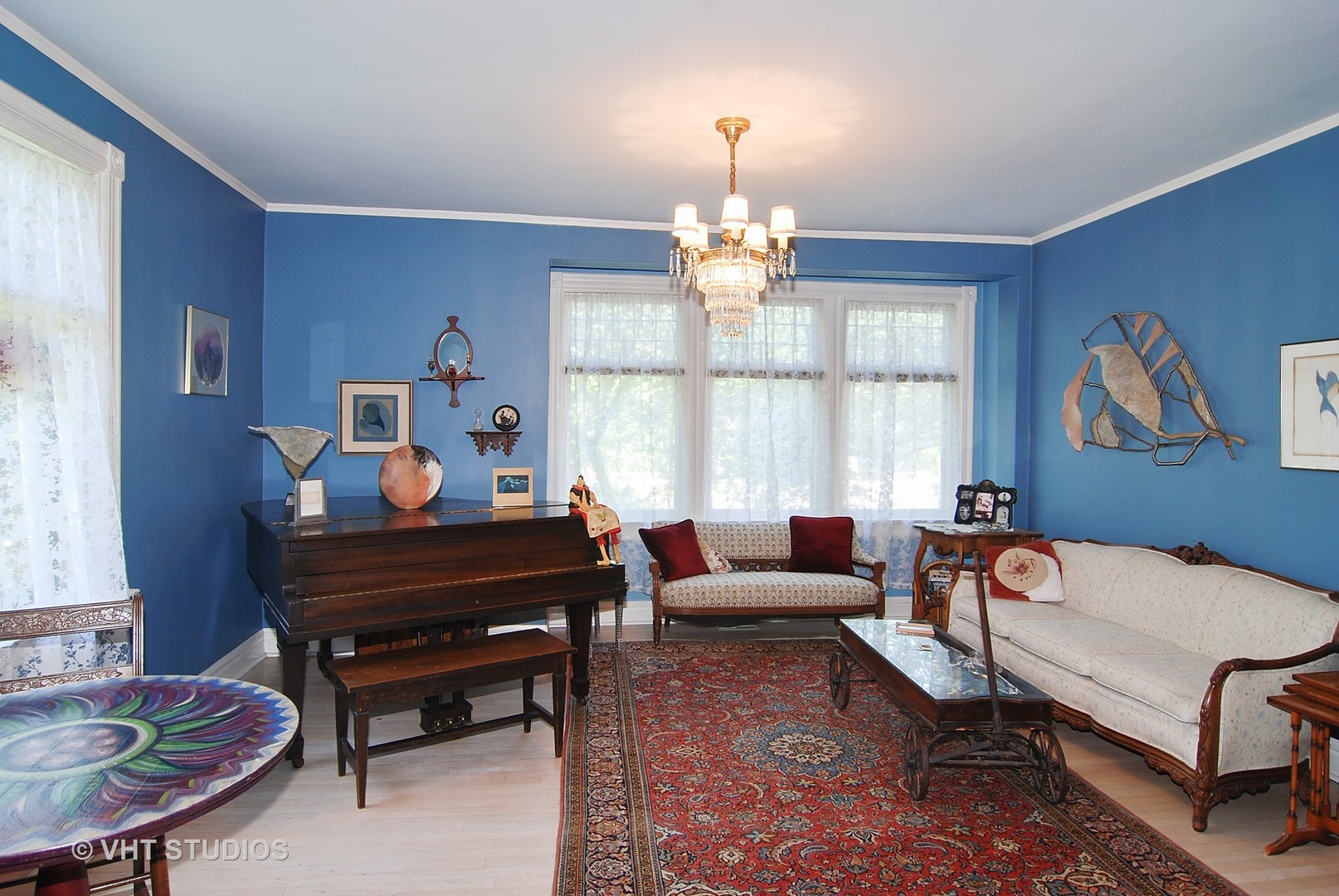 145 Woodside Road Riverside, IL 60546 - Photo 3 of 26 a living room with furniture chandelier and a window