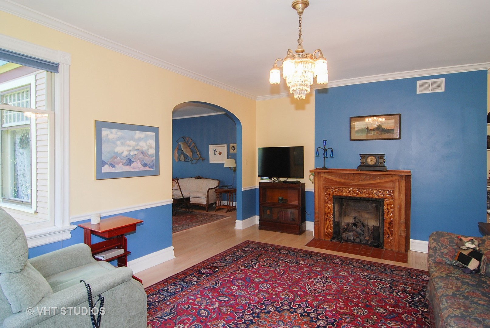 145 Woodside Road Riverside, IL 60546 - Photo 7 of 26 a living room with furniture a fireplace and a flat screen tv
