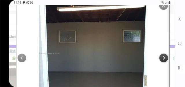 a view of empty room with windows