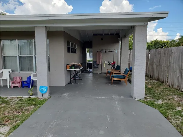 a kitchen with a refrigerator and a stove