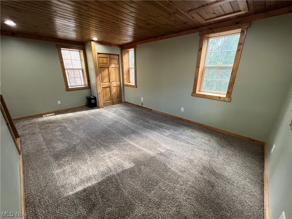 6544 Middle Run Road Dover, OH 44622 - Photo 27 of 47 Carpeted spare room with wooden ceiling
