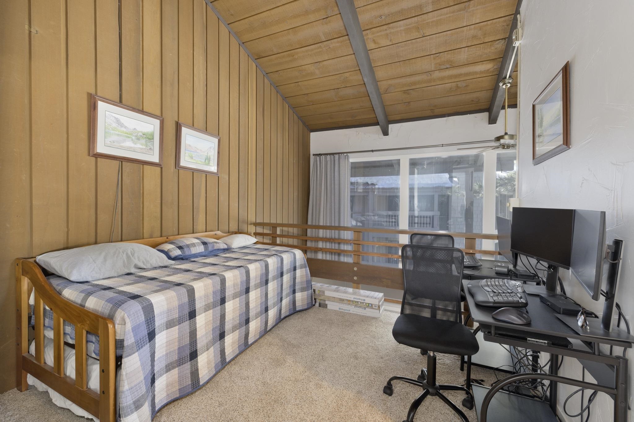 286 Old Mammoth Road, Unit 37 Mammoth Lakes, CA 93546 - Photo 16 of 33 Carpeted bedroom with a desk, vaulted ceiling with beams, wooden ceiling, and wooden walls