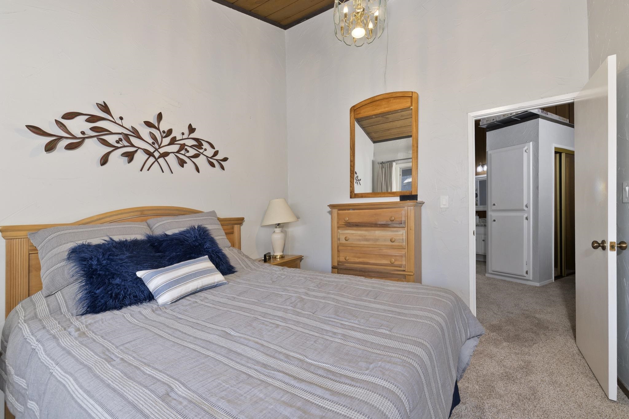 286 Old Mammoth Road, Unit 37 Mammoth Lakes, CA 93546 - Photo 23 of 33 Bedroom featuring light carpet and wood ceiling