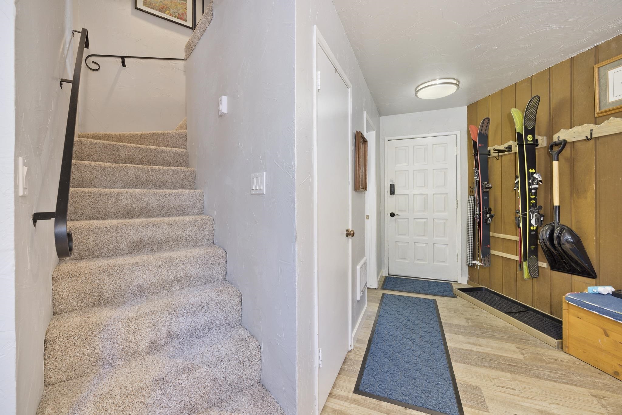 286 Old Mammoth Road, Unit 37 Mammoth Lakes, CA 93546 - Photo 3 of 33 Entrance foyer with light wood-style floors and wooden walls