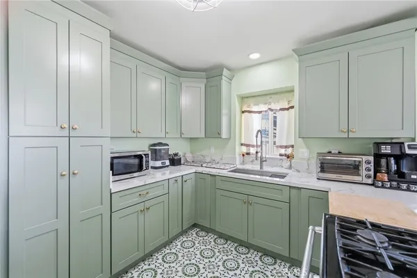 a kitchen with a sink and cabinets