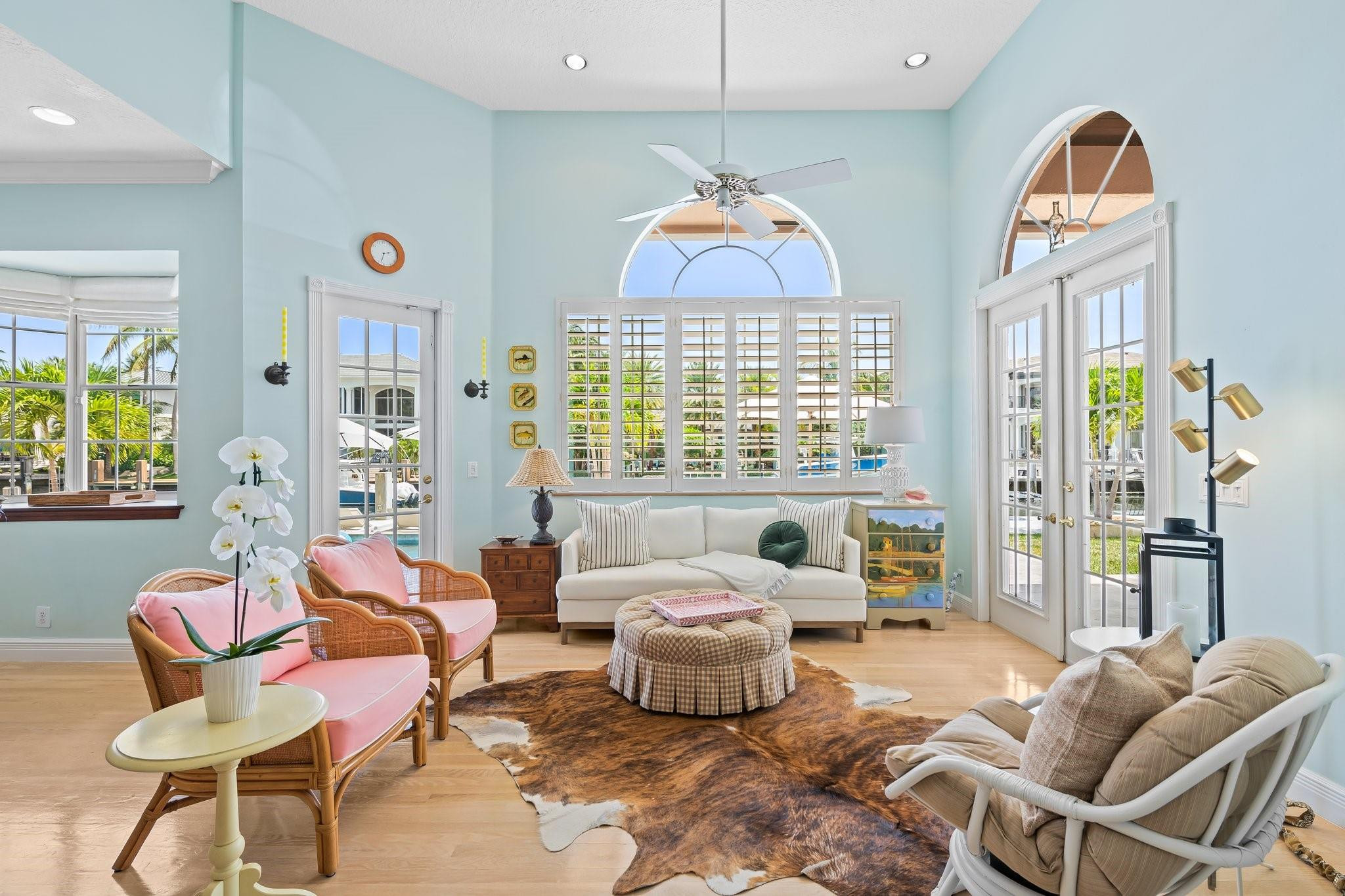 2342 Northeast 26th Street Lighthouse Point, FL 33064 - Photo 15 of 45 a living room with furniture chandelier and a large window