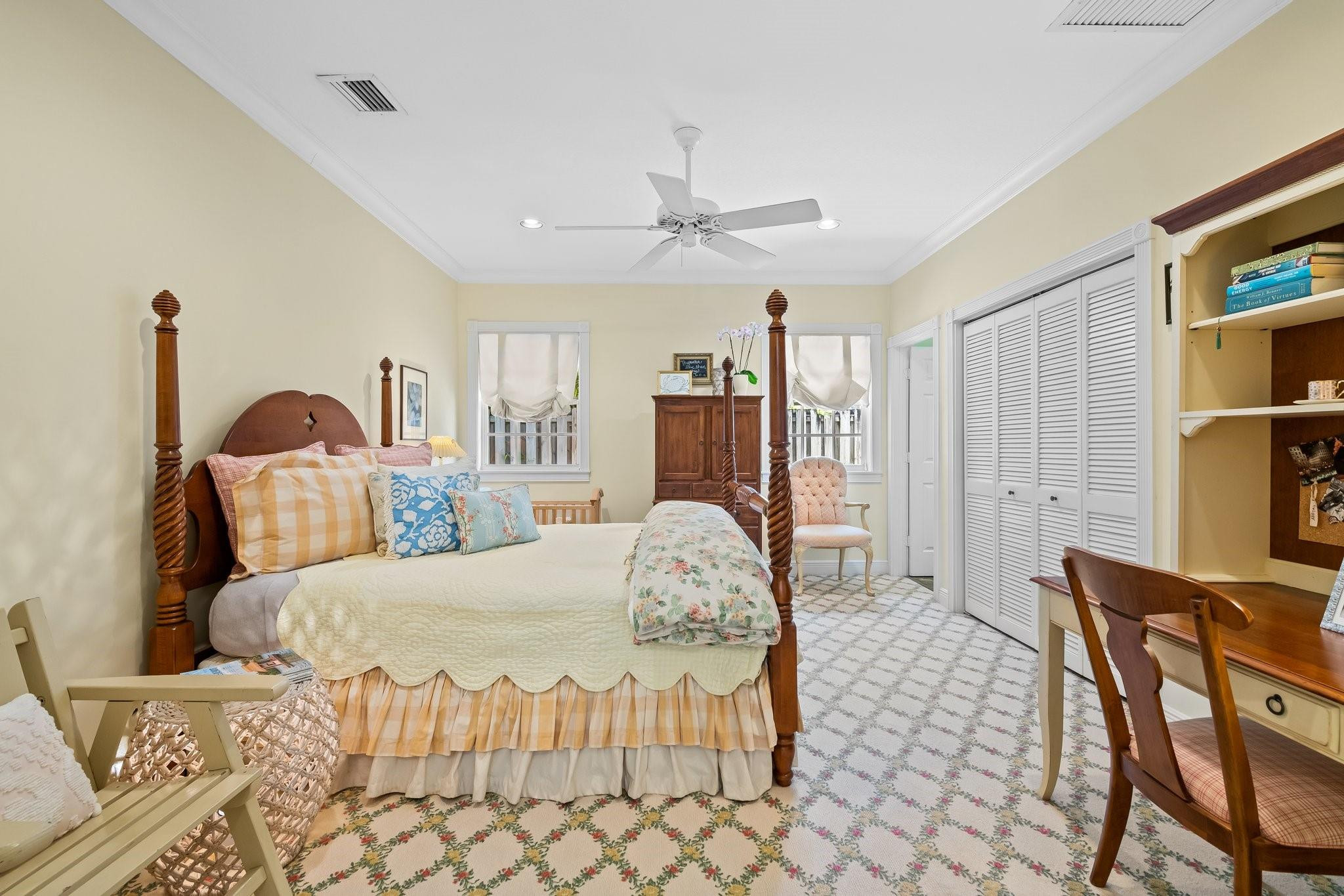 2342 Northeast 26th Street Lighthouse Point, FL 33064 - Photo 16 of 33 a bedroom with a bed a table and chair