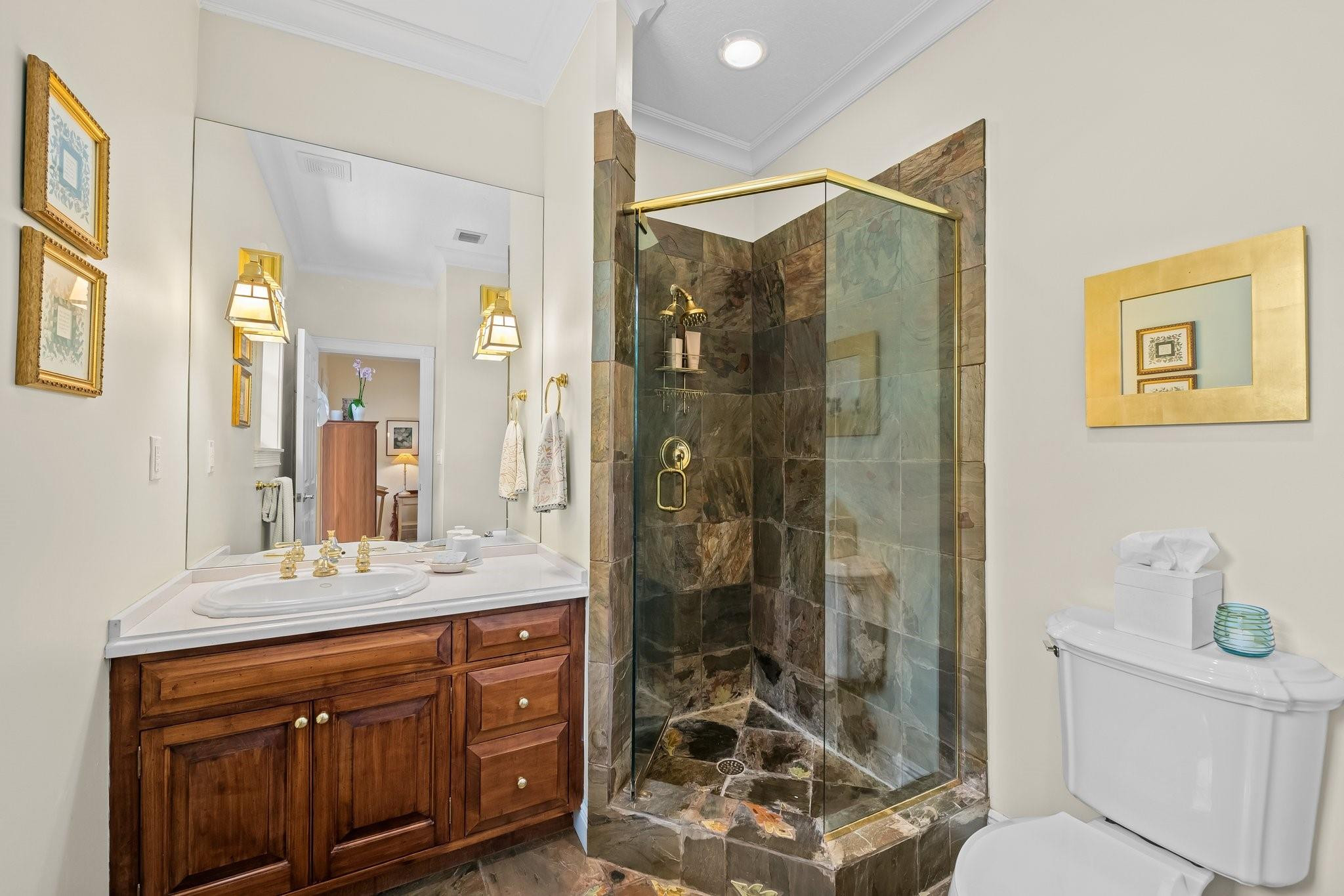 2342 Northeast 26th Street Lighthouse Point, FL 33064 - Photo 17 of 33 a bathroom with a shower sink vanity mirror and toilet