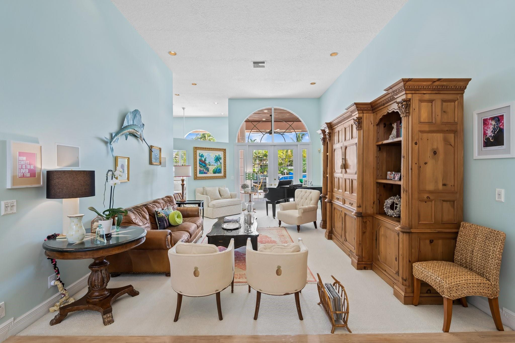 2342 Northeast 26th Street Lighthouse Point, FL 33064 - Photo 17 of 45 a living room with furniture and a chandelier