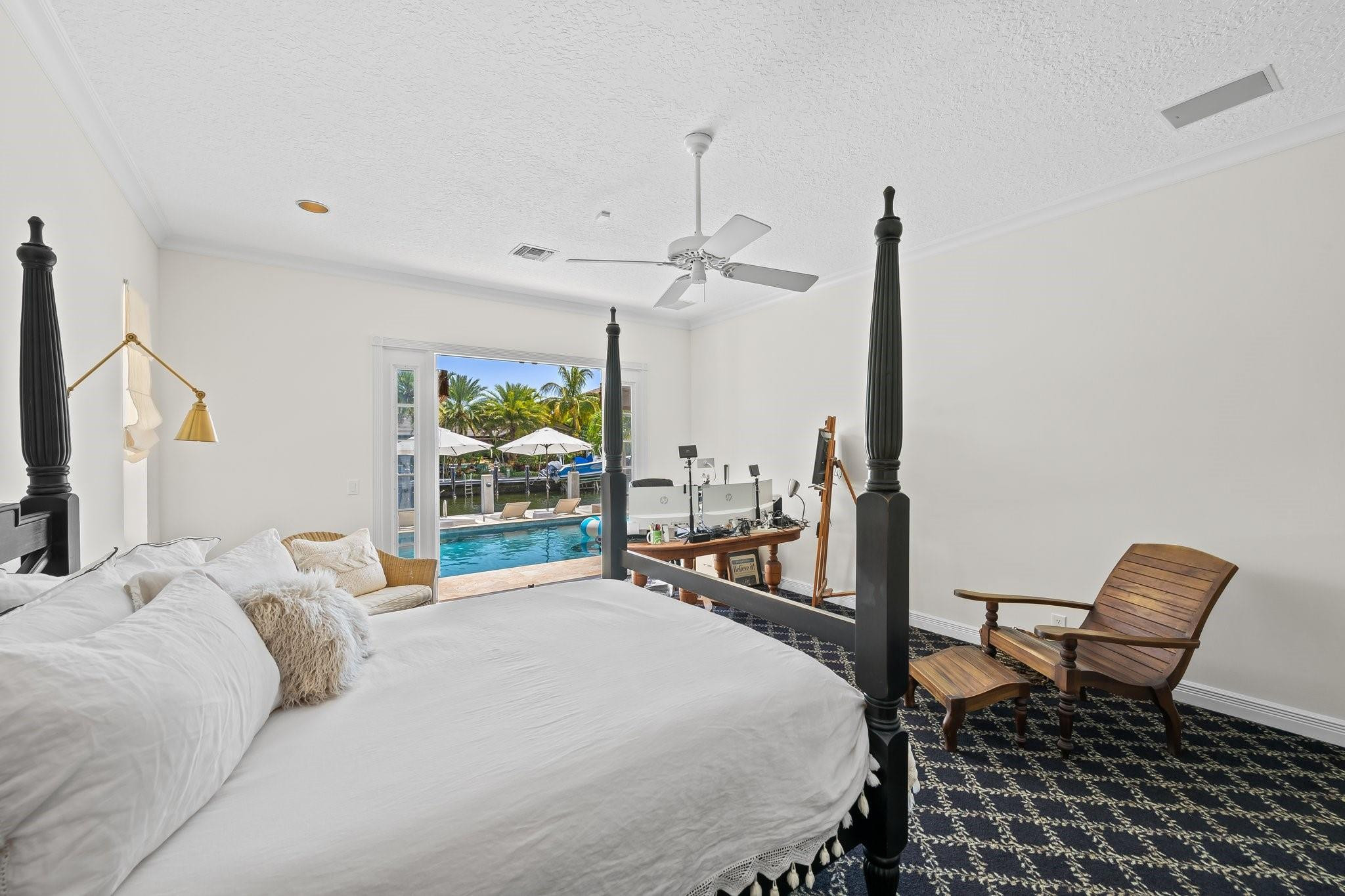 2342 Northeast 26th Street Lighthouse Point, FL 33064 - Photo 19 of 45 a bedroom with a bed window and walk in closet with window