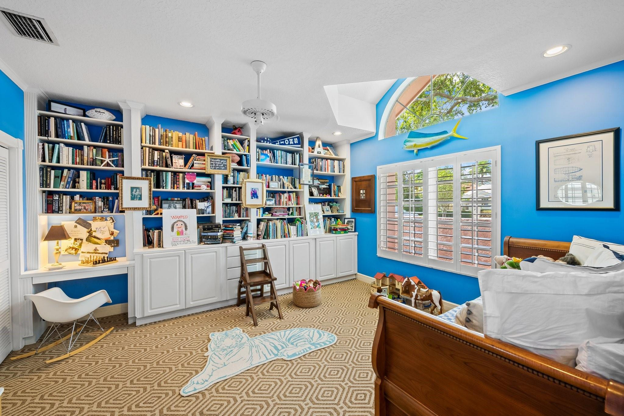 2342 Northeast 26th Street Lighthouse Point, FL 33064 - Photo 21 of 33 a living room with furniture and a book shelf