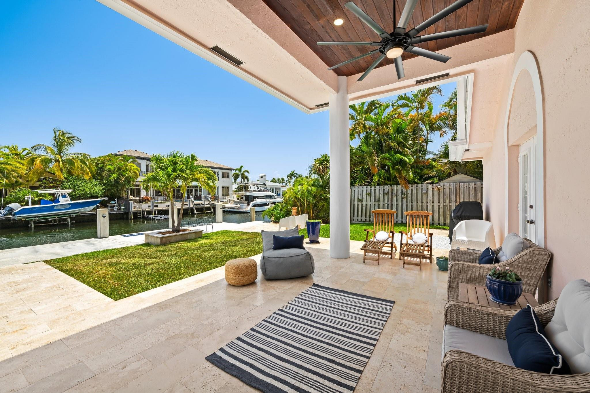 2342 Northeast 26th Street Lighthouse Point, FL 33064 - Photo 28 of 33 a view of a patio with couches and swimming pool