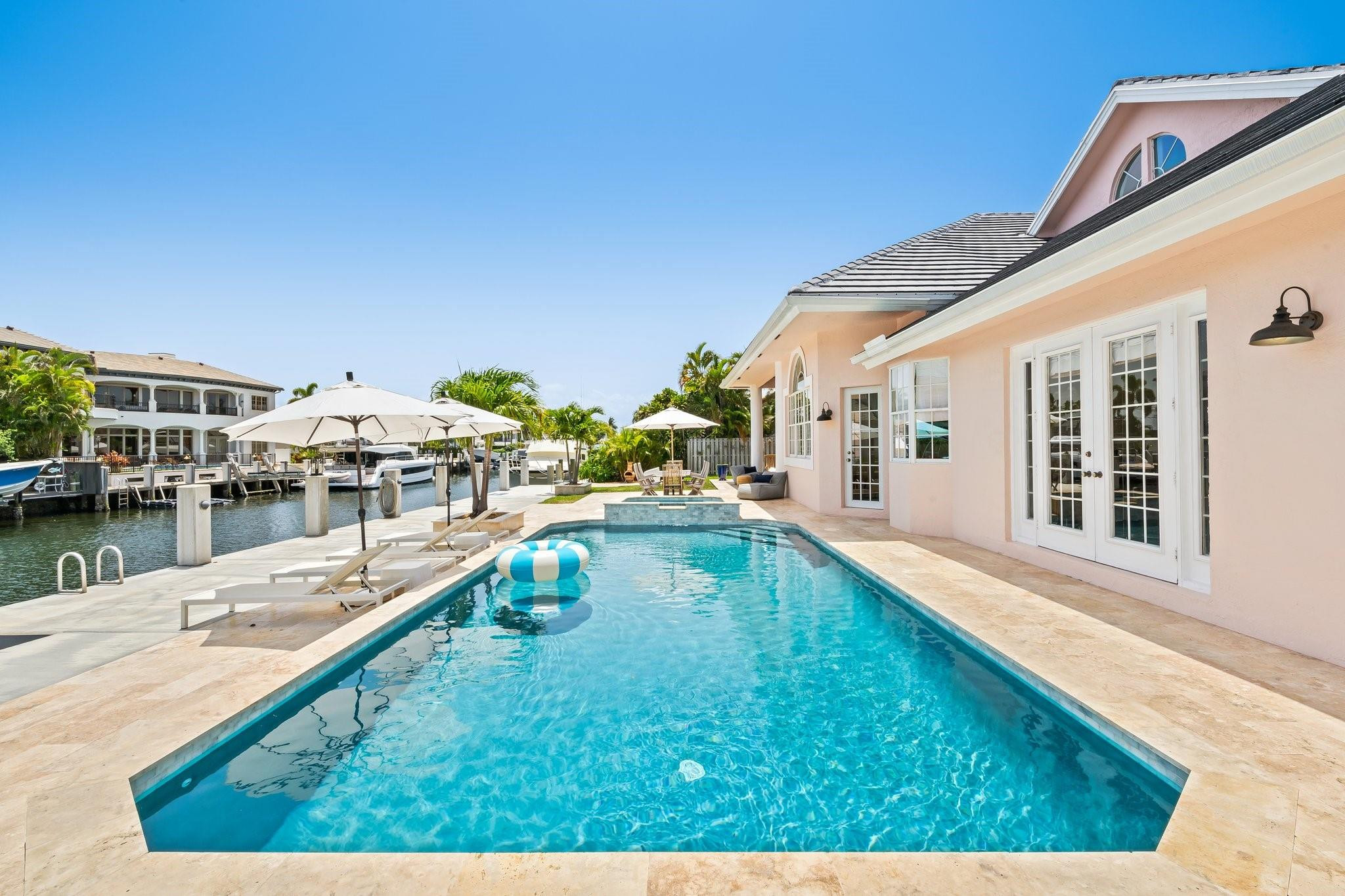 2342 Northeast 26th Street Lighthouse Point, FL 33064 - Photo 29 of 33 a view of a swimming pool with an outdoor seating