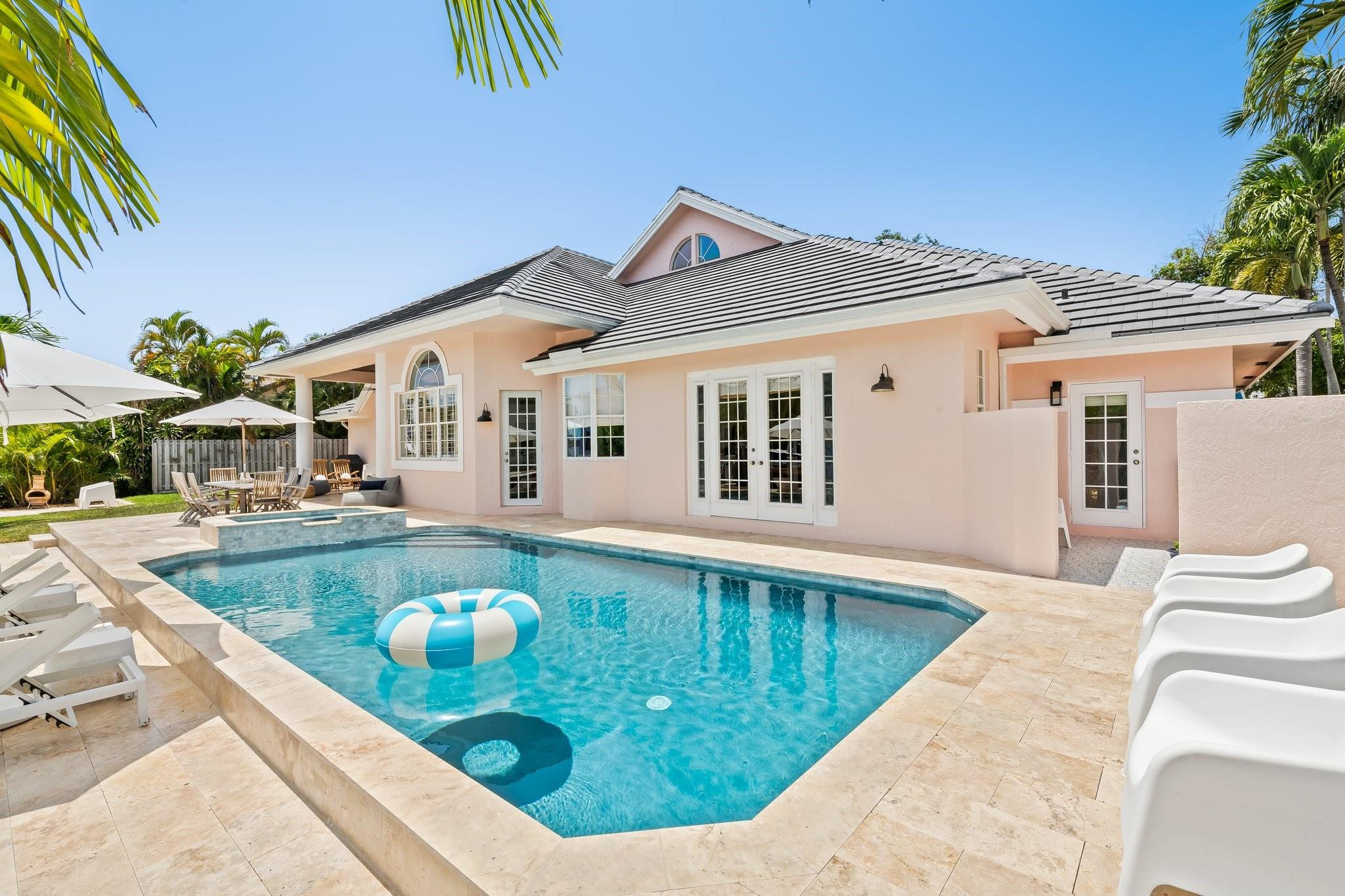 2342 Northeast 26th Street Lighthouse Point, FL 33064 - Photo 30 of 33 a view of a house with pool and chairs