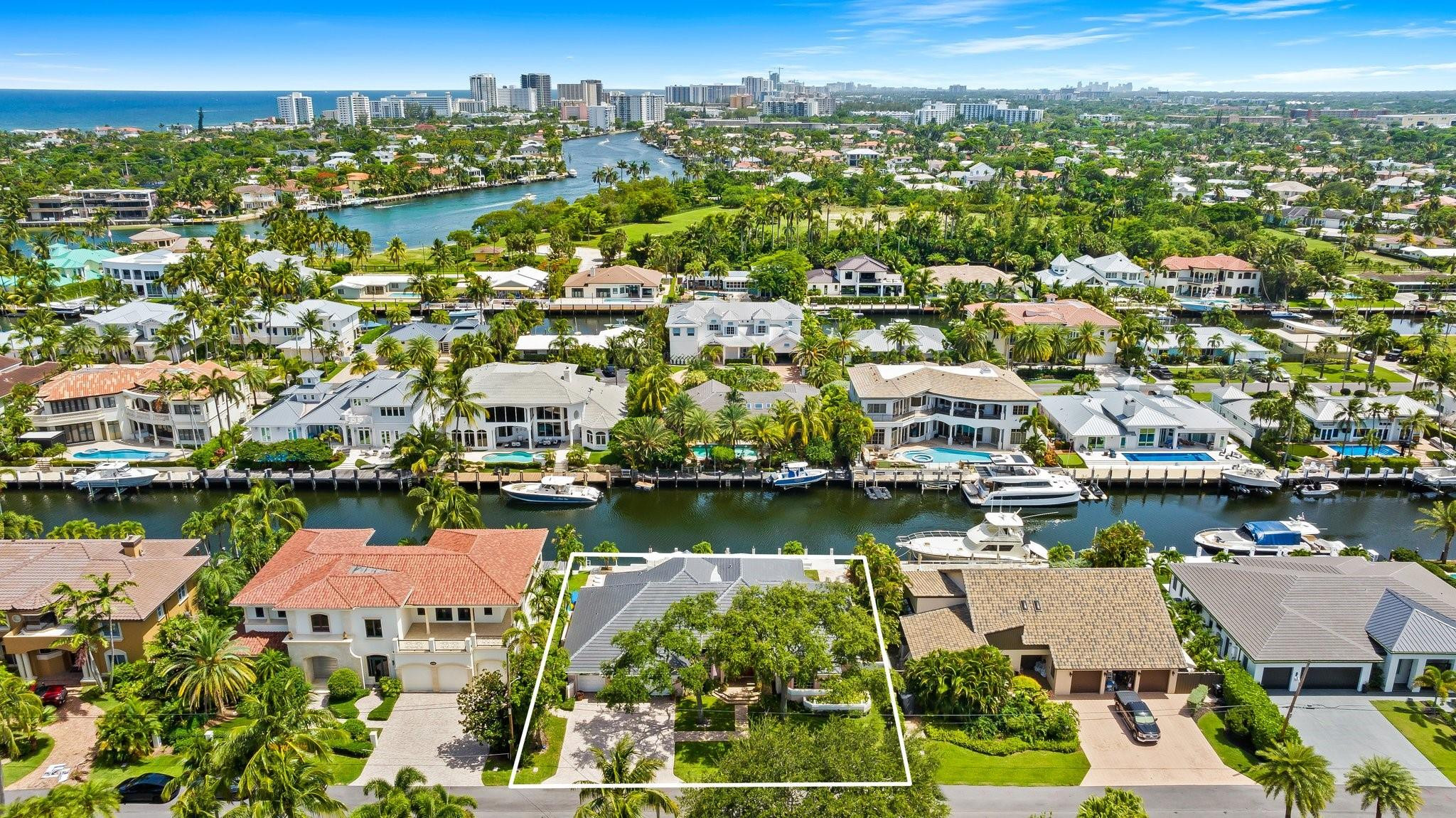2342 Northeast 26th Street Lighthouse Point, FL 33064 - Photo 3 of 45 an aerial view of residential houses with outdoor space and lake view