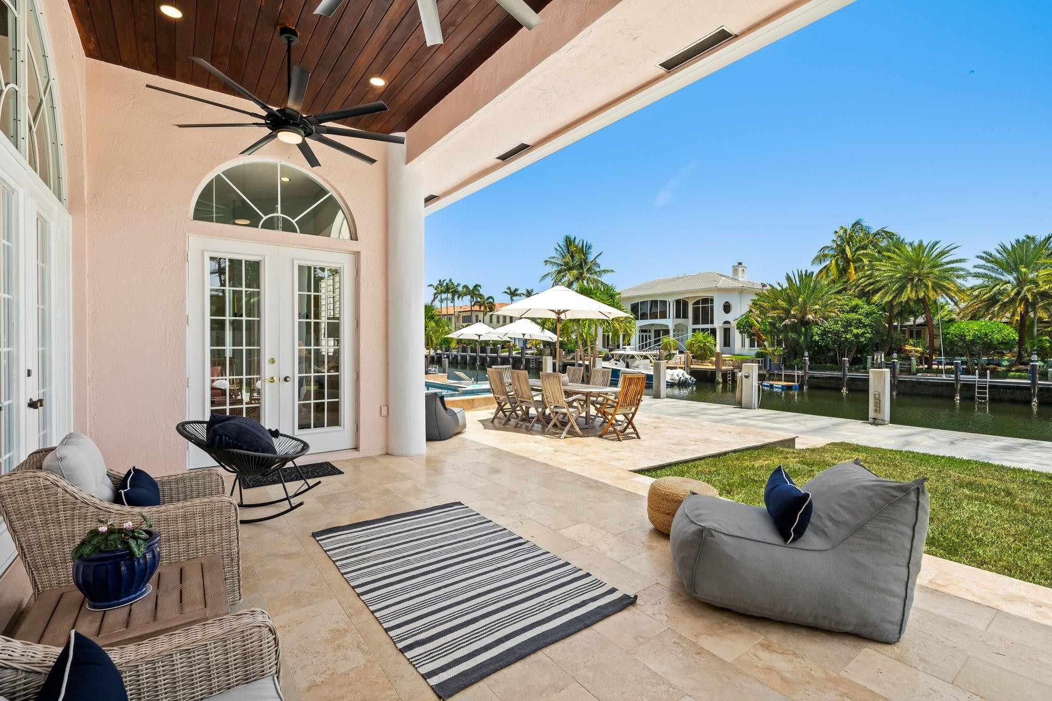 2342 Northeast 26th Street Lighthouse Point, FL 33064 - Photo 7 of 45 a living room with furniture and a large umbrella